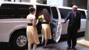 Bridesmaids Entering Limousine